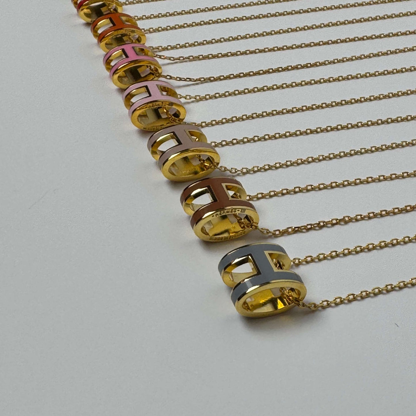 Yellow gold enamel H pendant necklaces in multiple colors