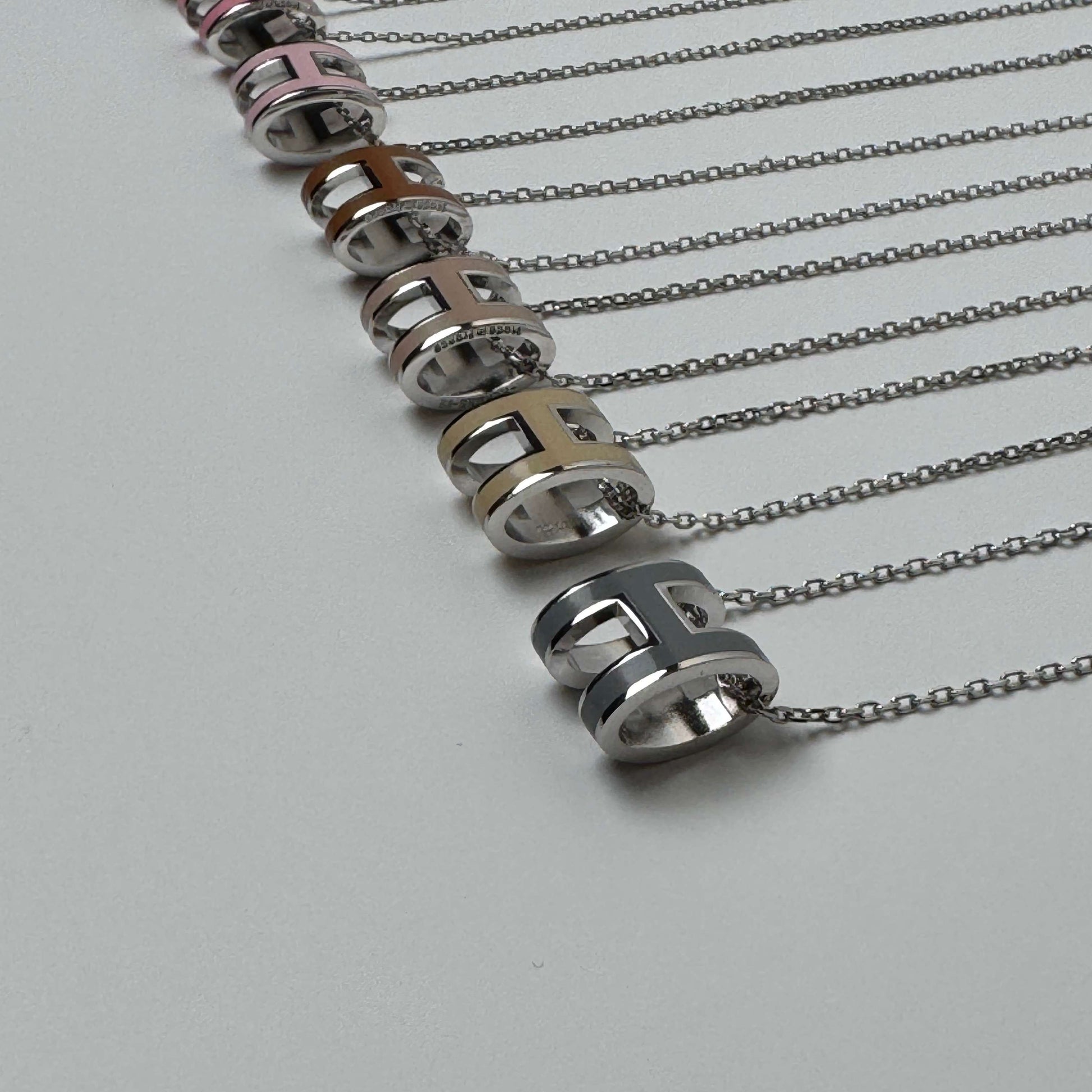 White gold enamel H pendant necklace side view