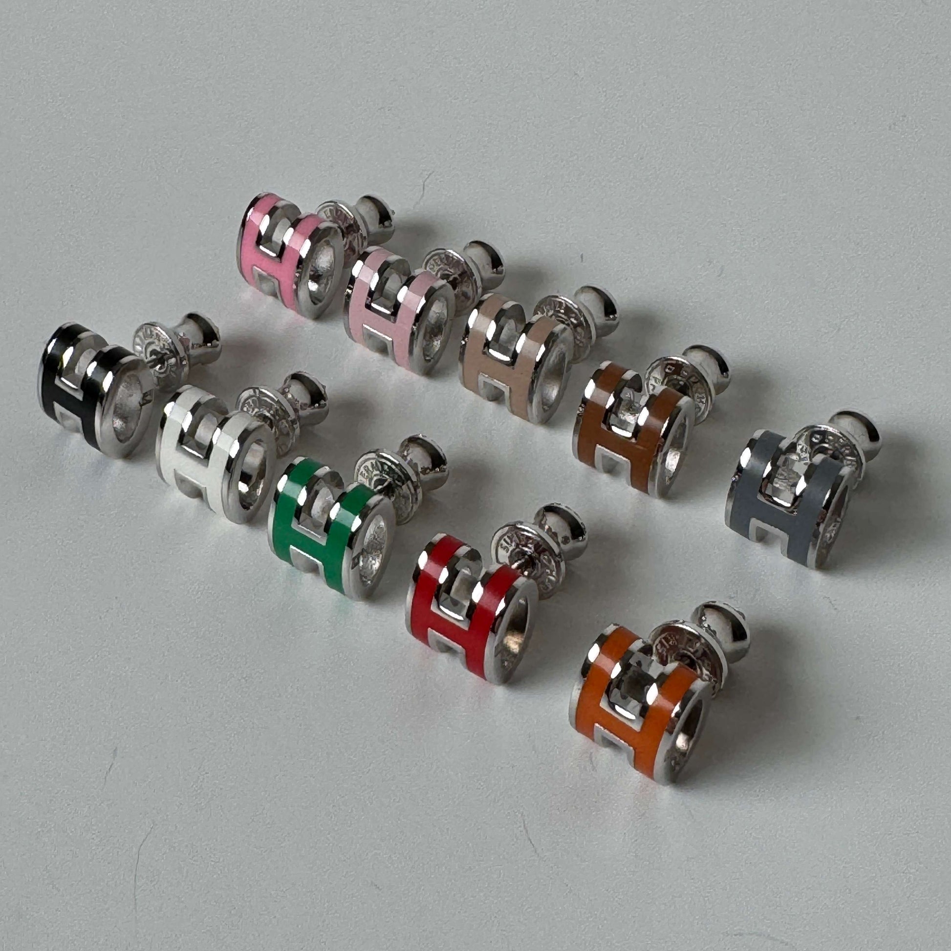 White gold enamel H stud earrings in multiple colors