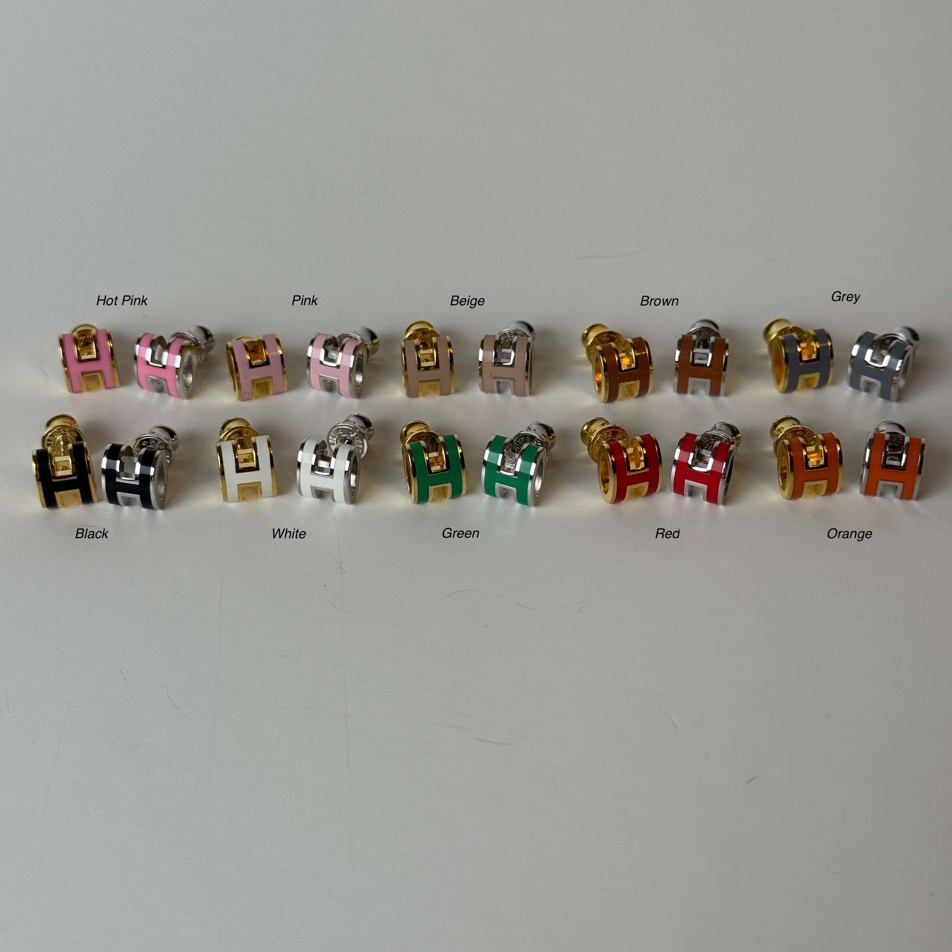 H stud earrings front view in multiple col
