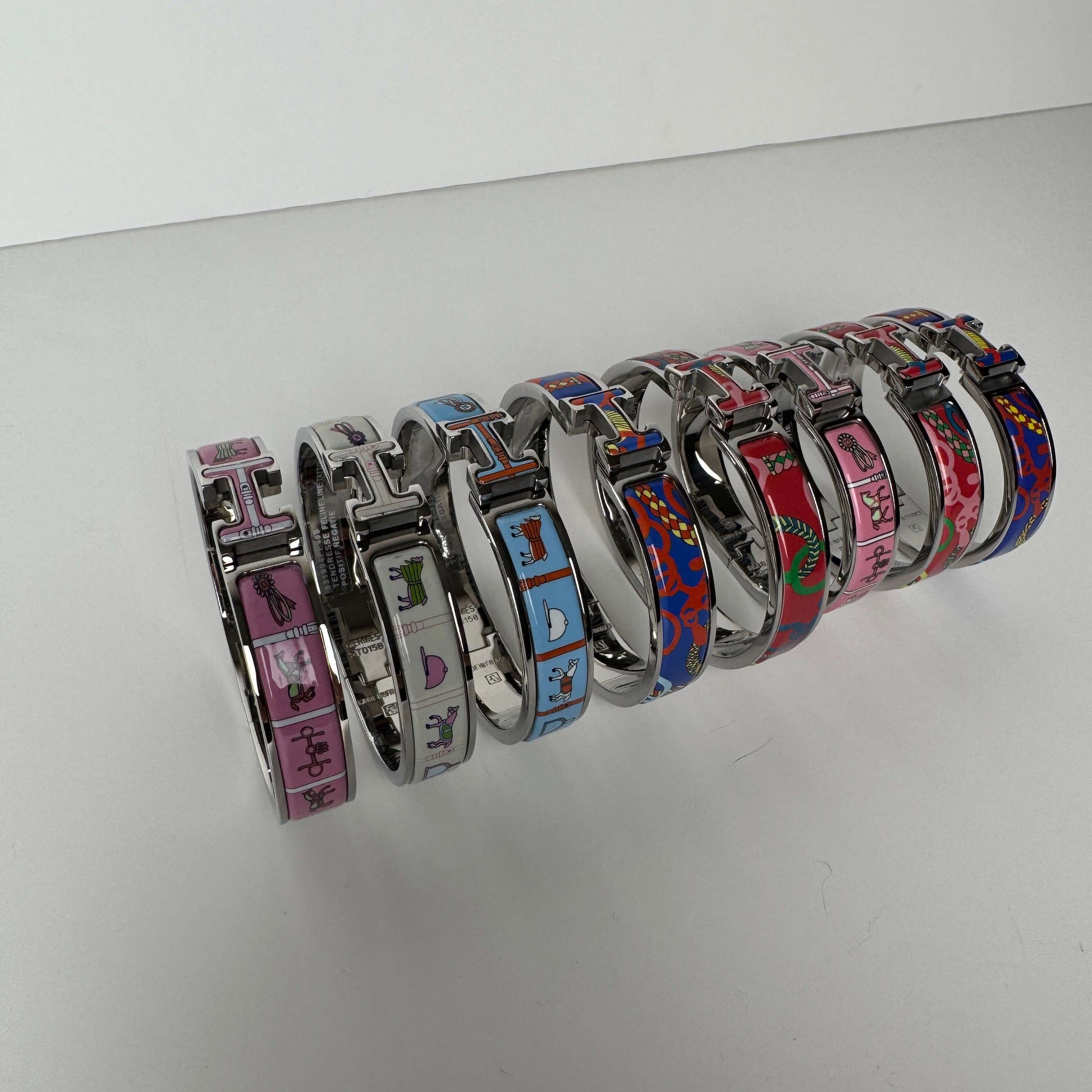 White gold printed enamel H bangles front view