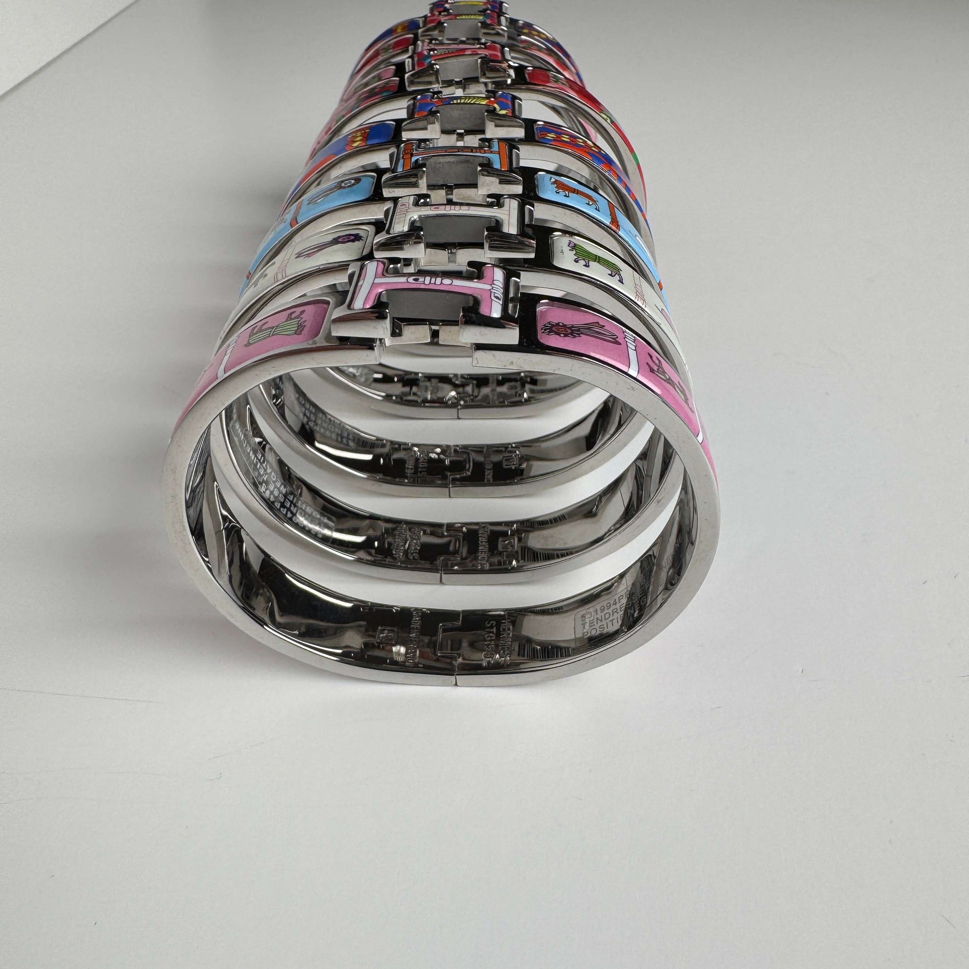 White gold printed enamel H bangles front view