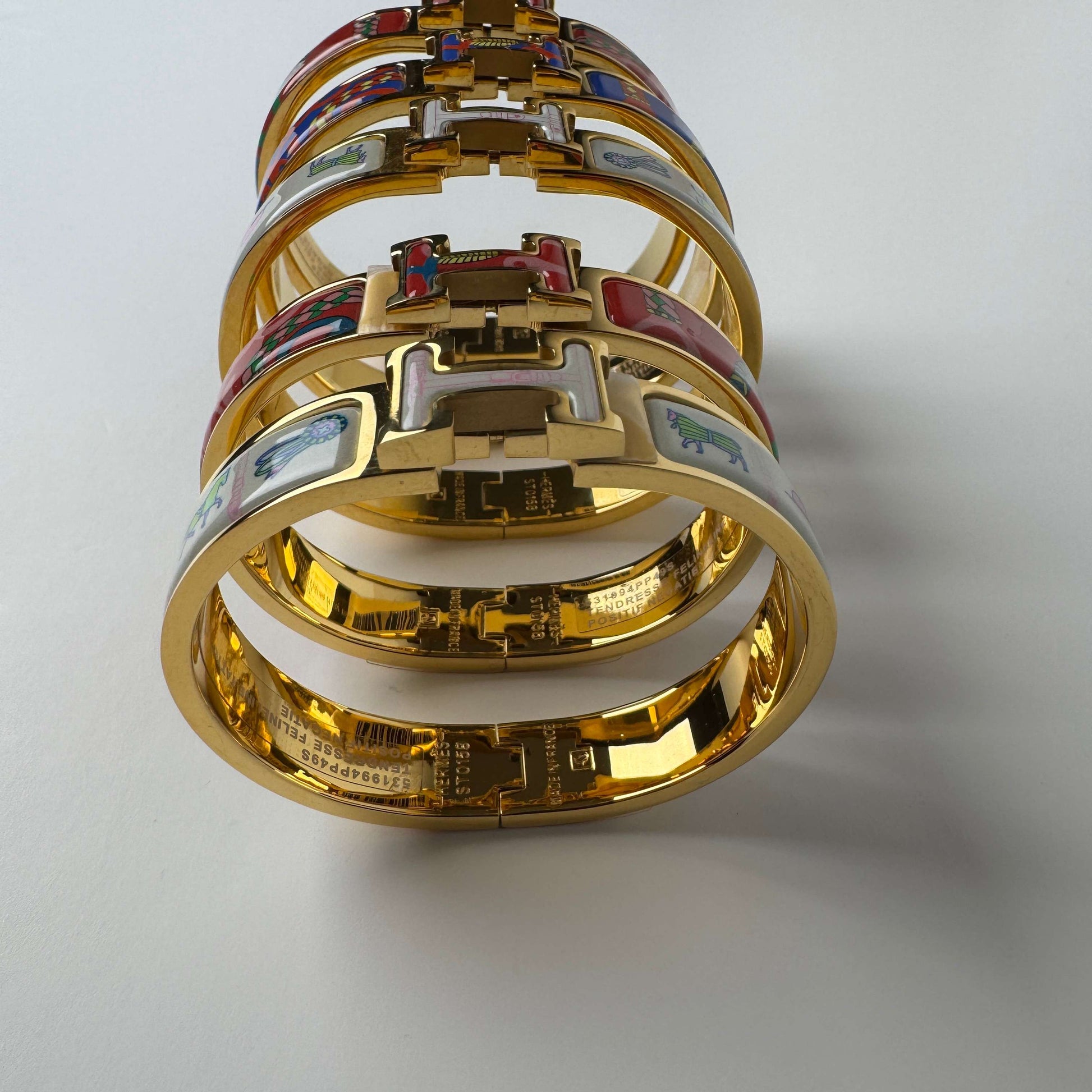 Yellow gold printed enamel H bangles front vi