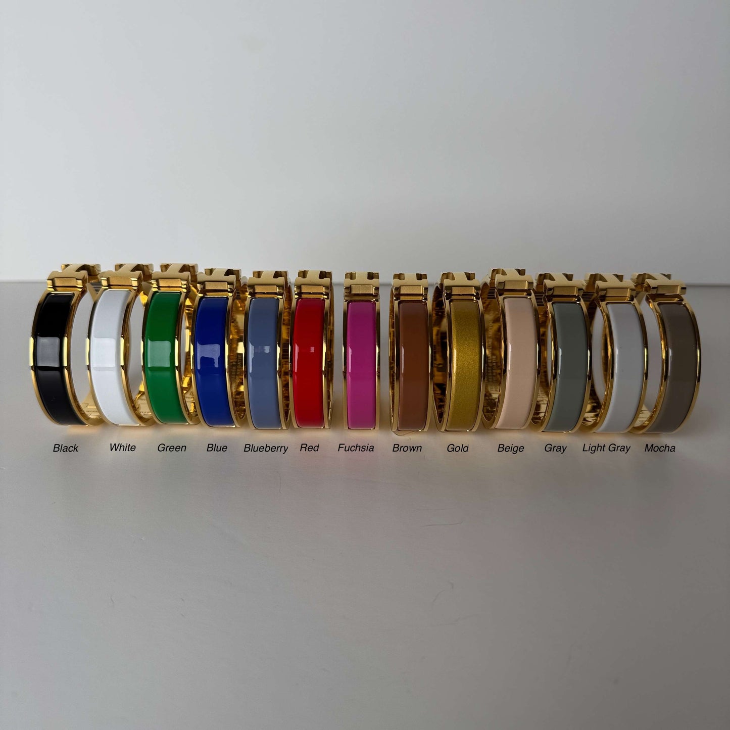 Yellow gold enamel H bangles side view in multiple colors
