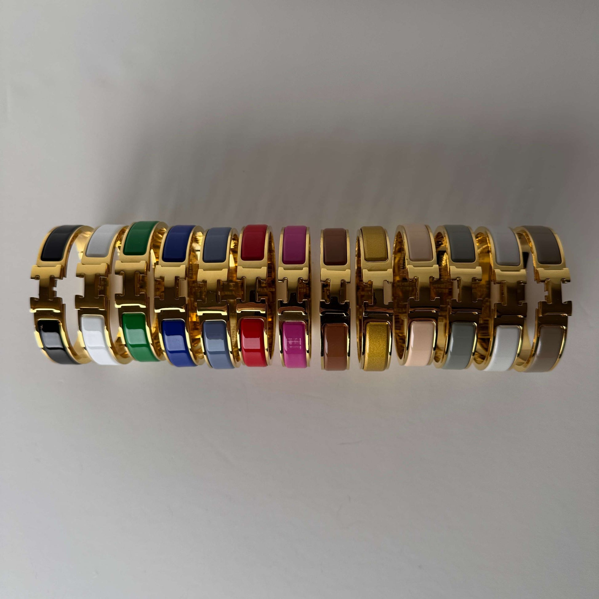 Yellow gold enamel H bangles front view