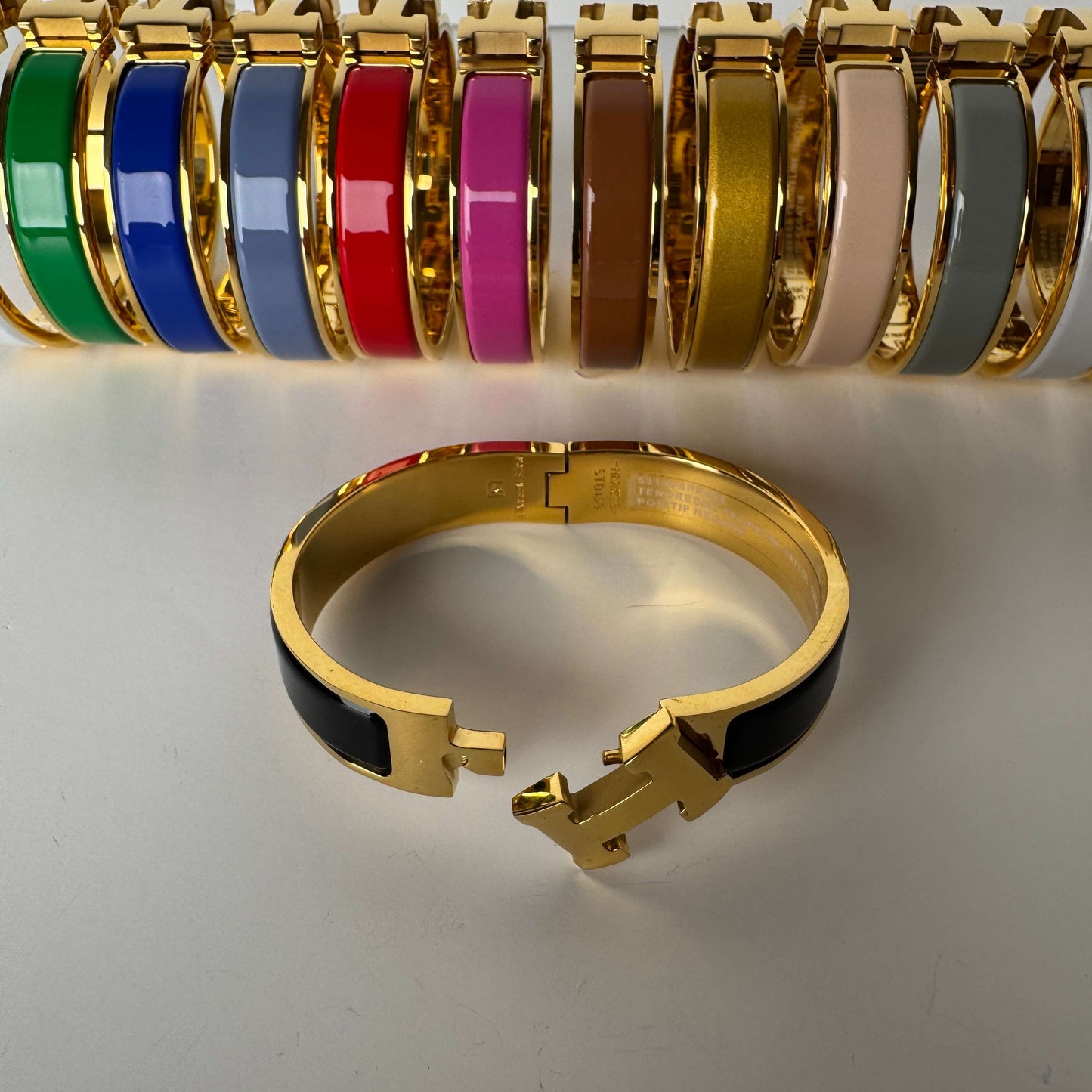 Yellow gold enamel H bangles in multiple colors