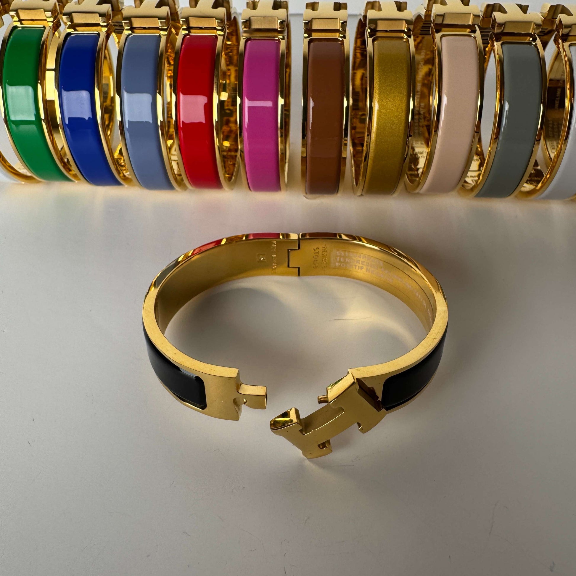 Yellow gold enamel H bangles in multiple colors