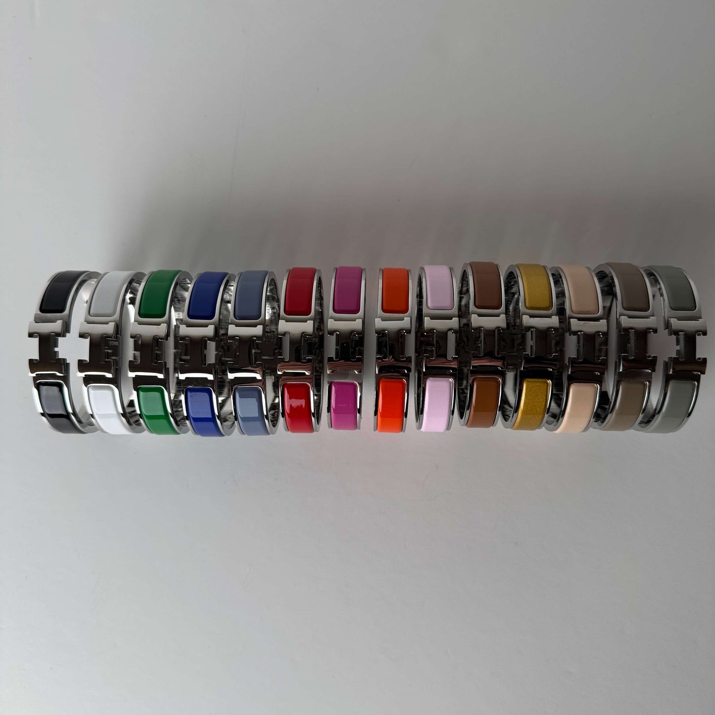 White gold enamel H bangles front view