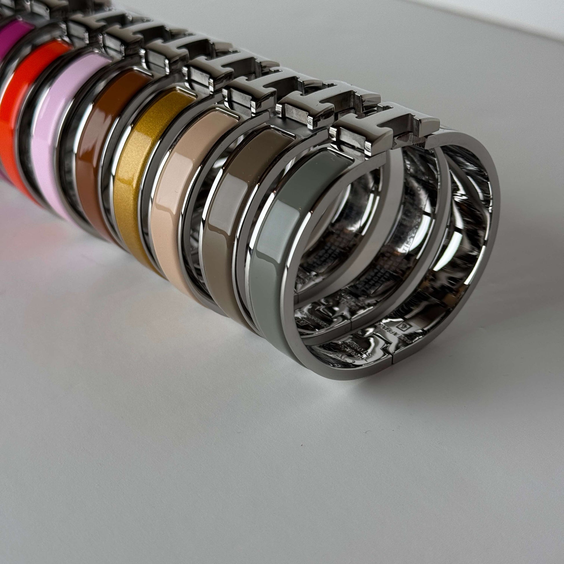White gold enamel H bangles stacked view